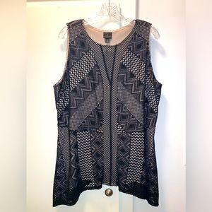 Sleeveless top. Zipper on side. Form fitting.